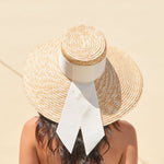Eugenia Kim Mirabel sunhat in ivory grosgrain back view on model