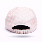 Backwards view of pink and white gingham hat background