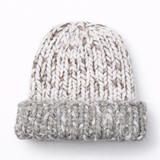Knitted beanie with a gradient from white to gray on a white background