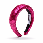 Fuchsia sequined headband with a brand label on a white background