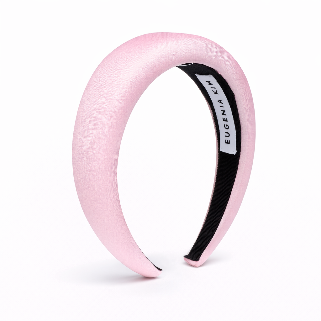 Pink headband with black interior on a white background