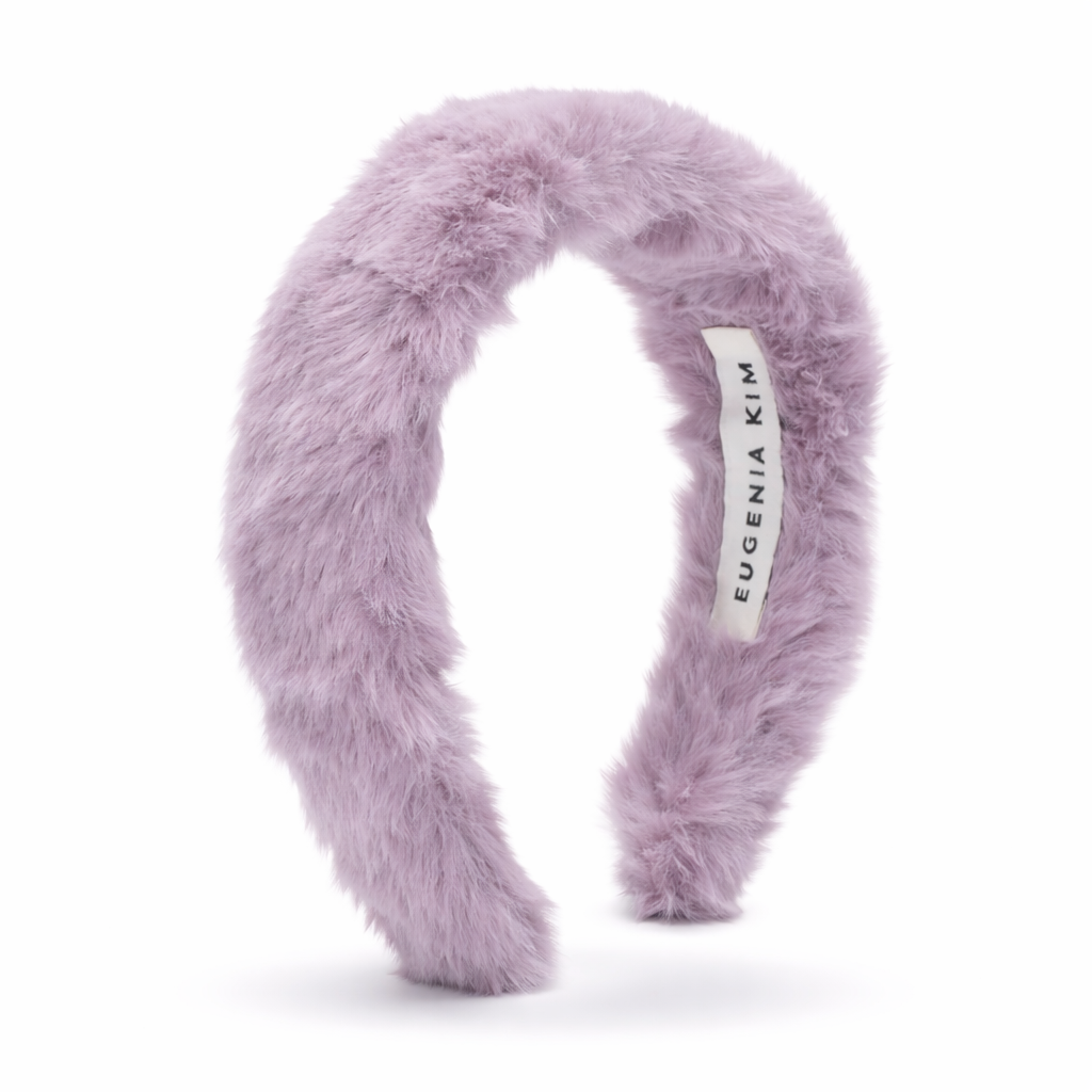 Purple fluffy headband with a visible brand label on a white background