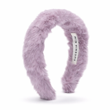 Purple fluffy headband with a visible brand label on a white background