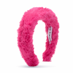 Pink fuzzy headband with a visible brand label on a white background