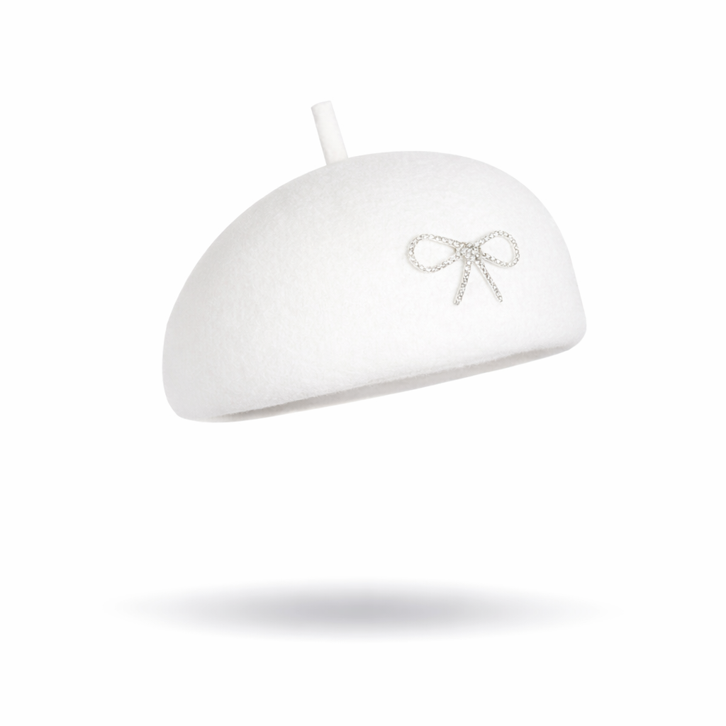 White beret with a decorative bow on a white background