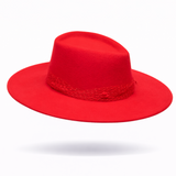 Red fedora hat with red birdcage vail on a white background