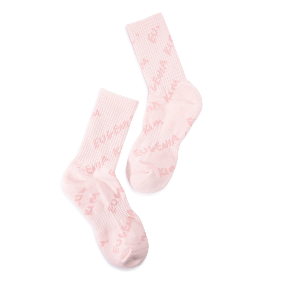 Pair of pink socks with jacquard socks on a white background