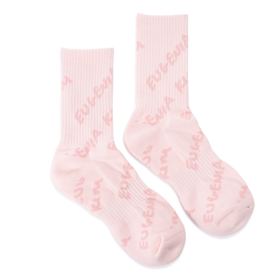 Pair of pink socks with jacquard socks on a white background