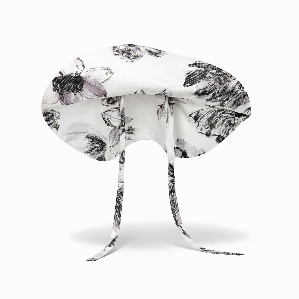 White headband with black floral pattern on a white background