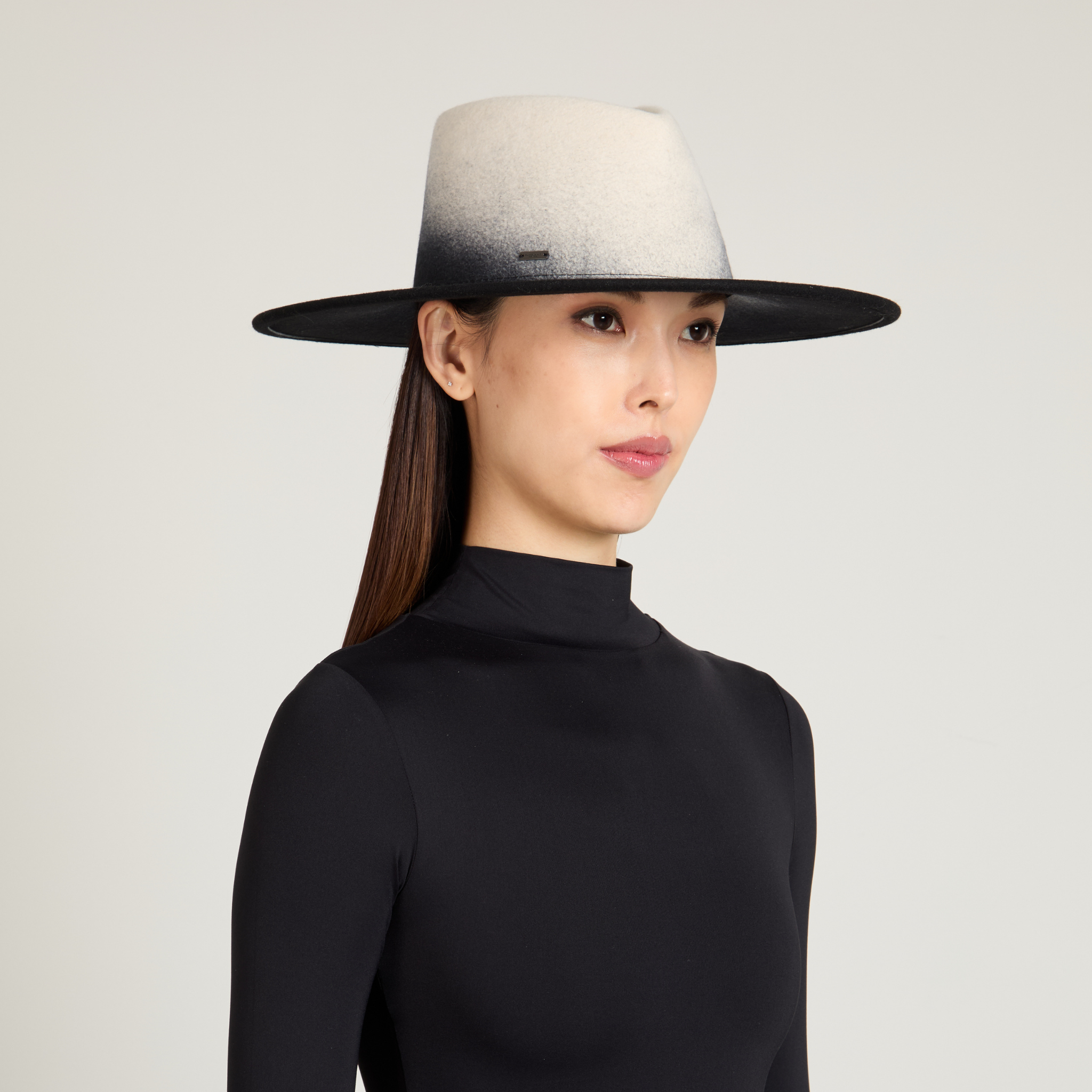 Model wearing the Harlowe fedora in black gradient wool felt Winter 2025