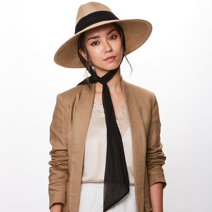 Eugenia Kim Cassidy packable fedora in sand with black scarf front view on model 