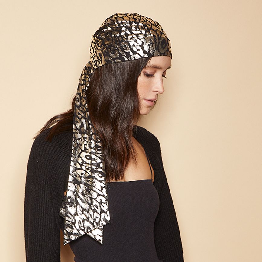 Eugenia Kim Gigi headscarf in gold/black leopard side view on model