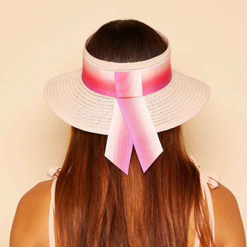 Back shot on model of Kayla visor in pink ombre. 