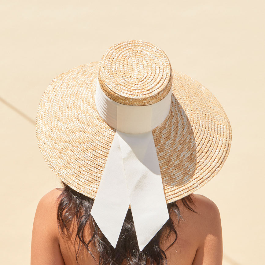 Eugenia Kim Mirabel sunhat in ivory grosgrain back view on model