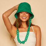 Front view of model wearing Yuki bucket hat in Kelly Green